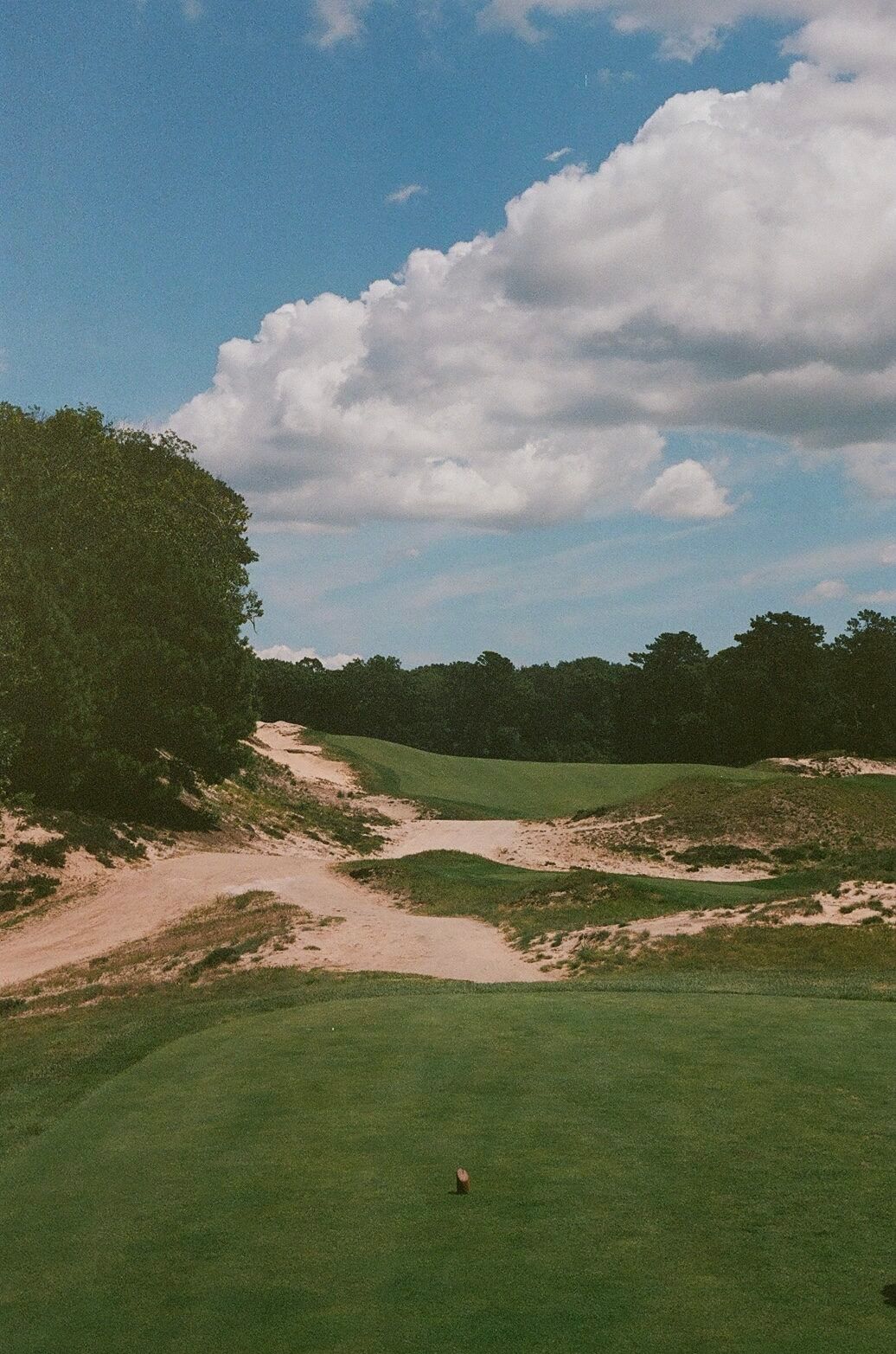 Friar's Head clubhouse perched on the bluff at golden hour