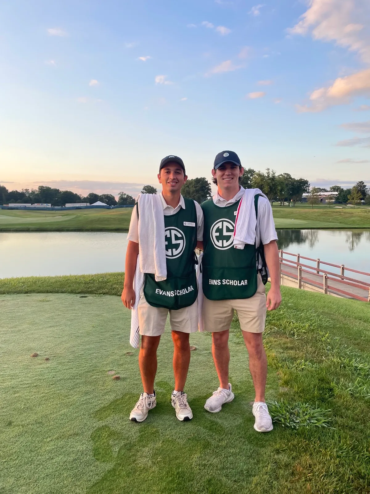 Evans Scholar caddies at sunset on the course