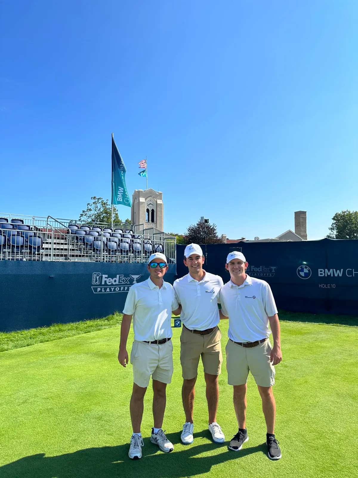 Evans Scholar caddies at the 10th hole with FedEx Cup Playoffs signage